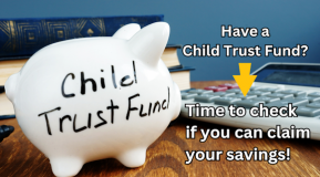 photo of a pottery piggy bank sitting on a desk by a pc keyboard with the wording Child Trust Fund written on the side of it