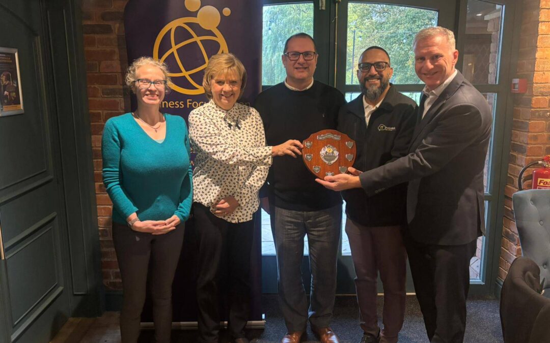 Winning team presented with trophy from Alexander Accountancy charity quiz night