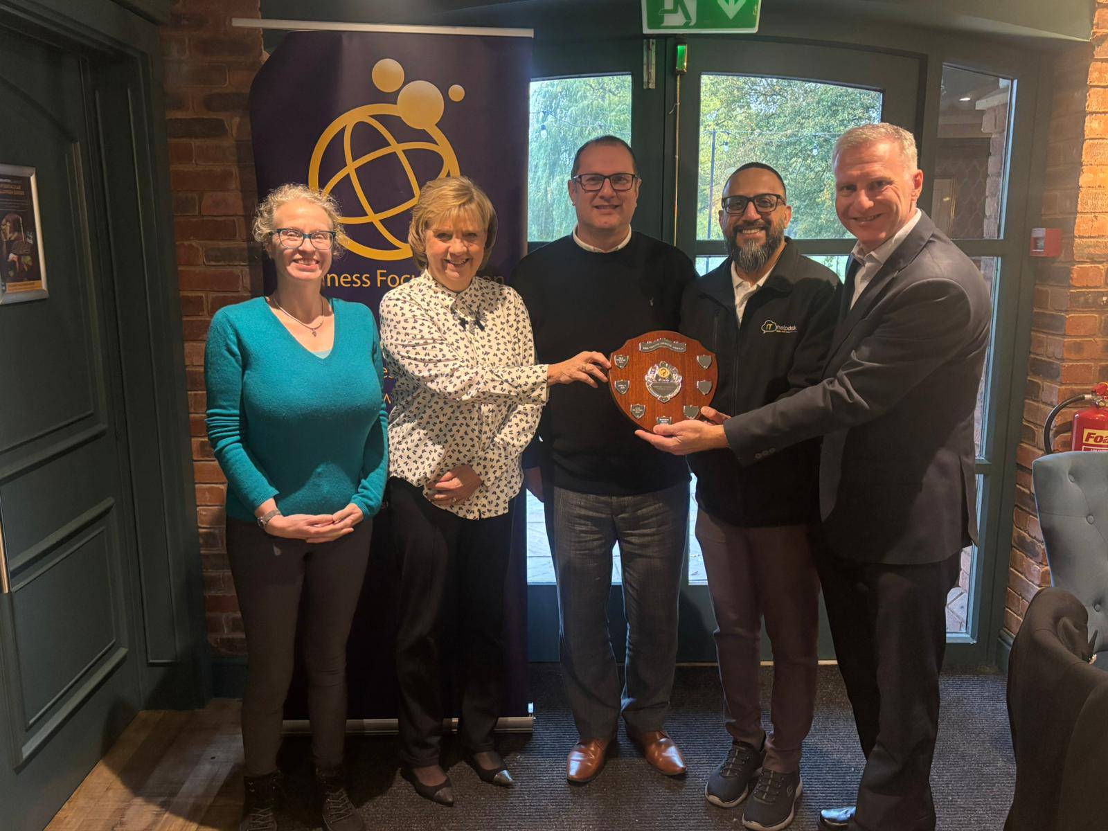 Winning team presented with trophy from Alexander Accountancy charity quiz night Winning team presented with trophy from Alexander Accountancy charity quiz night